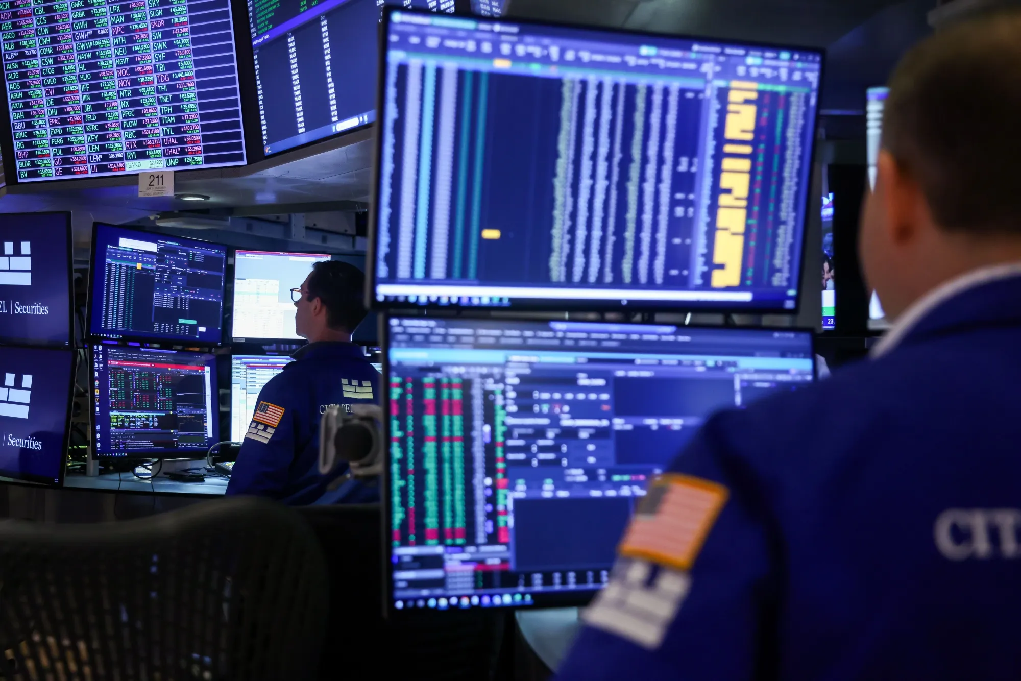 Traders work on the floor at the New York Stock Exchange.