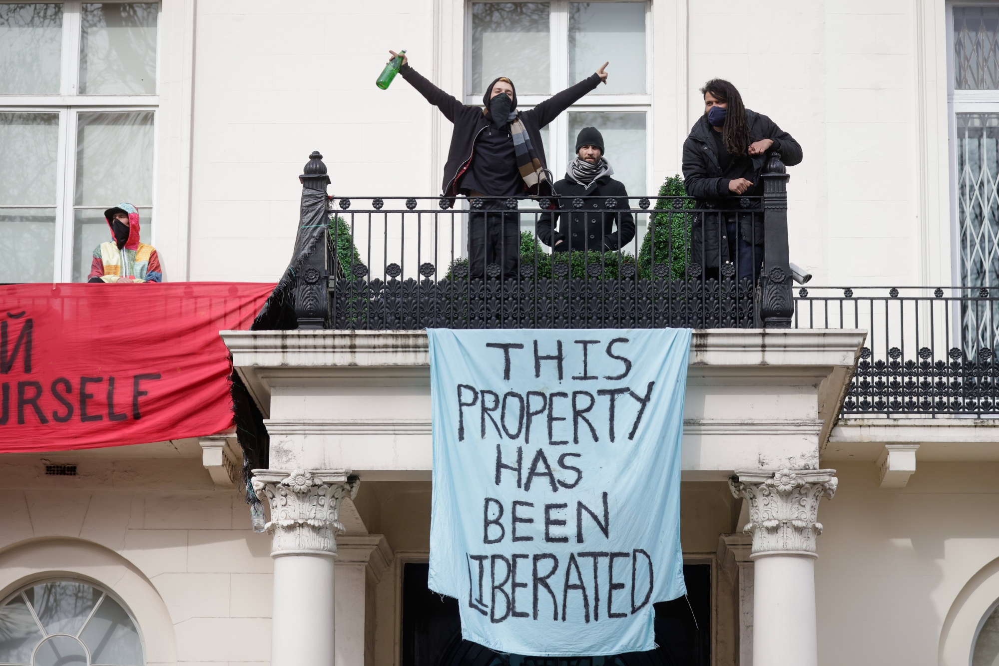War protesters occupy a mansion linked to billionaire Oleg Deripaska in London, on March 14.