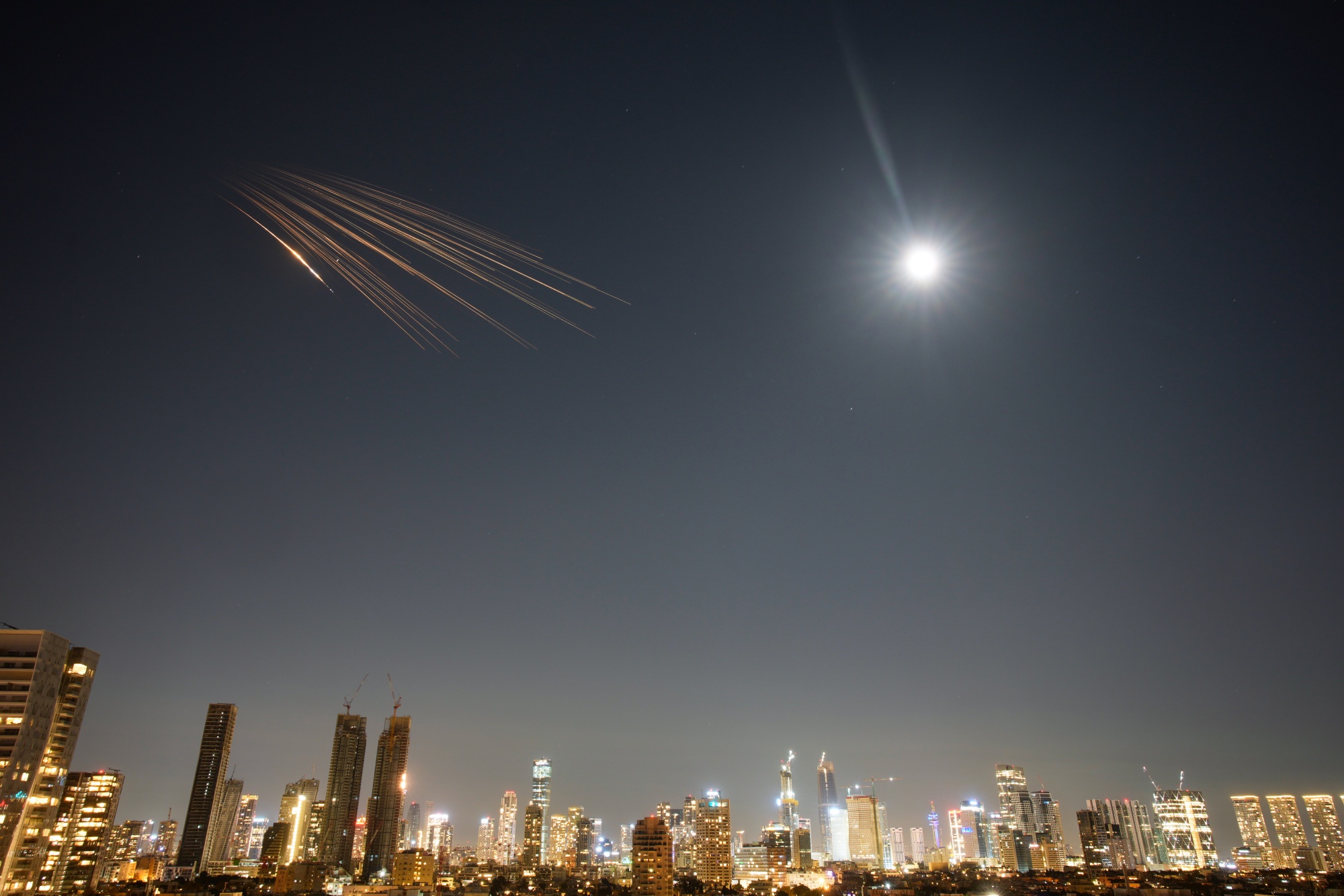 Iranian missiles over central Israel, on March 5. Photographer: Ohad Zwigenberg/AP Photo