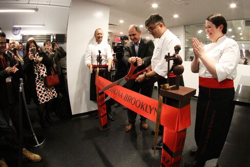 Jean-Luc Grisot and Frédéric Bau cut the ribbon at Valrhona's grand opening in Brooklyn.