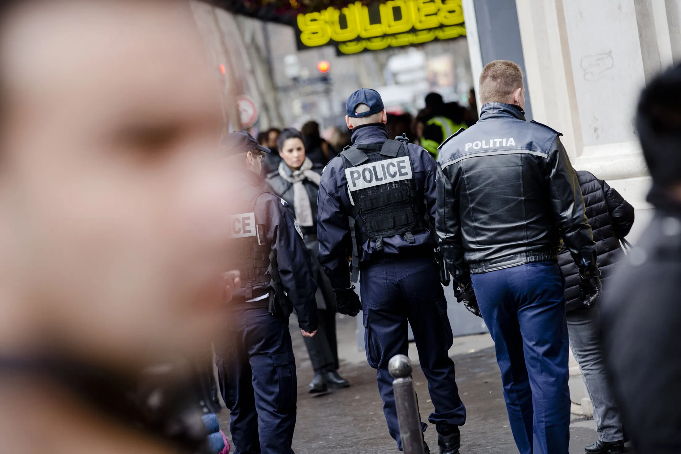Police officers patrol near Galeries Lafayette SA department store during the first day of new year retail sales in Paris, France, on Wednesday, Jan. 6, 2016. The Bank of France cut its forecast for fourth-quarter growth in the euro region's second-largest economy, confirming business has been affected by the Nov. 13 terrorist attacks that killed 130 in Paris.
