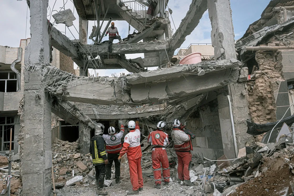 First responders inspect the remains of a residential building hit in an airstrike in Tabriz, East Azerbaijan Province, Iran on&nbsp;&nbsp;March 24.