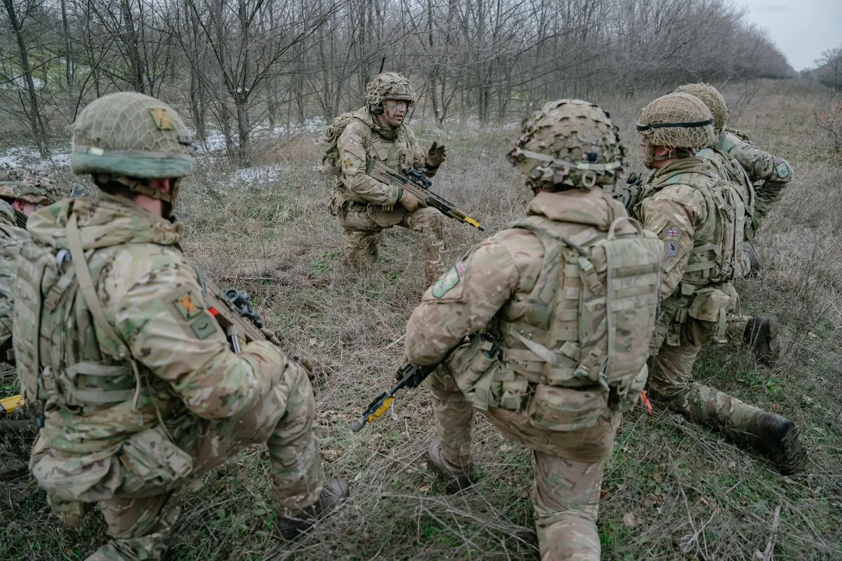 Soldiers train in a forest during an exercise in Smardan, Romania, on Feb. 17.