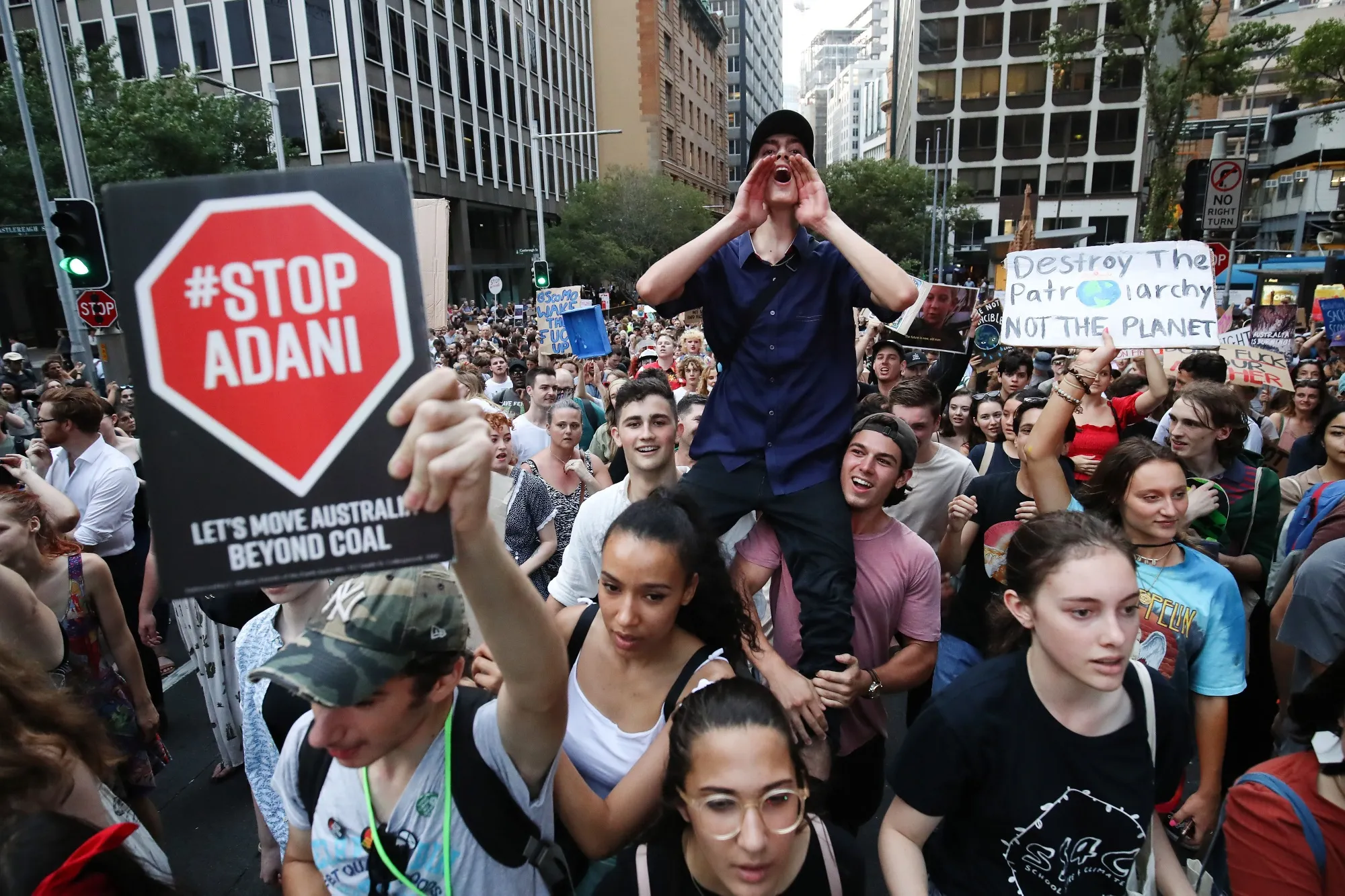 Demonstrators shout slogans and carry placards during a protest in Sydney on&nbsp;Jan. 10.