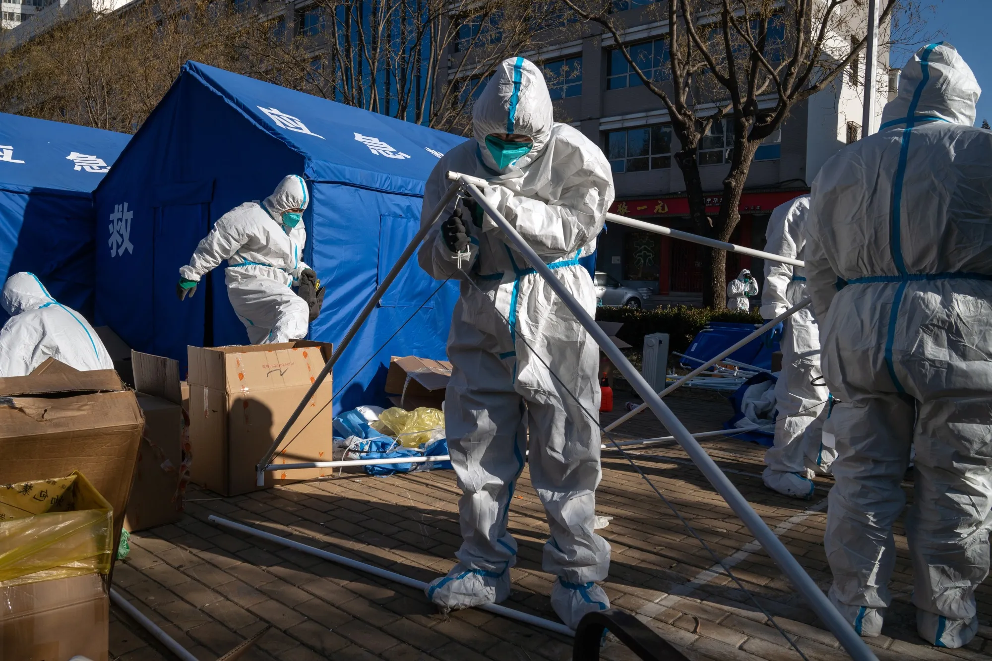 Workers dismantle a temporary shelter outside a neighborhood under lockdown due to Covid in Beijing.
