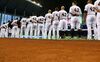The Miami Marlins line up during a game against the Washington Nationals at Marlins Park on April 15, 2014 in Miami, Florida.
