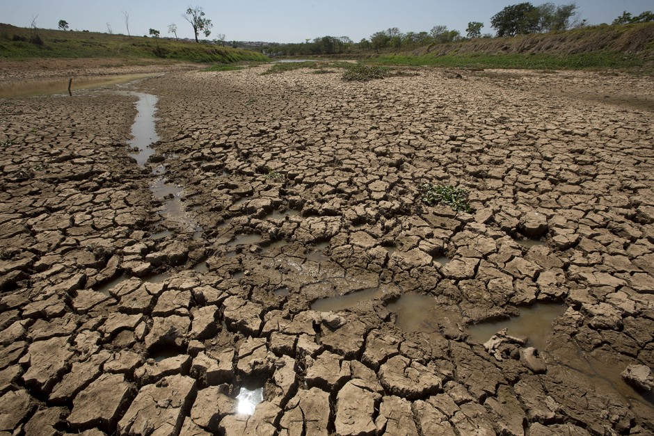 In this Oct. 30, 2014 photo, the earth lays cracked in the nearly empty Itaim dam, responsible for providing water to the Sao Paulo metropolitan area, which is experiencing the worst drought to hit southeastern Brazil in more than eight decades.