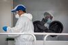 Medical workers test residents at a mobile Covid-19 testing site in Miami Beach, Florida.