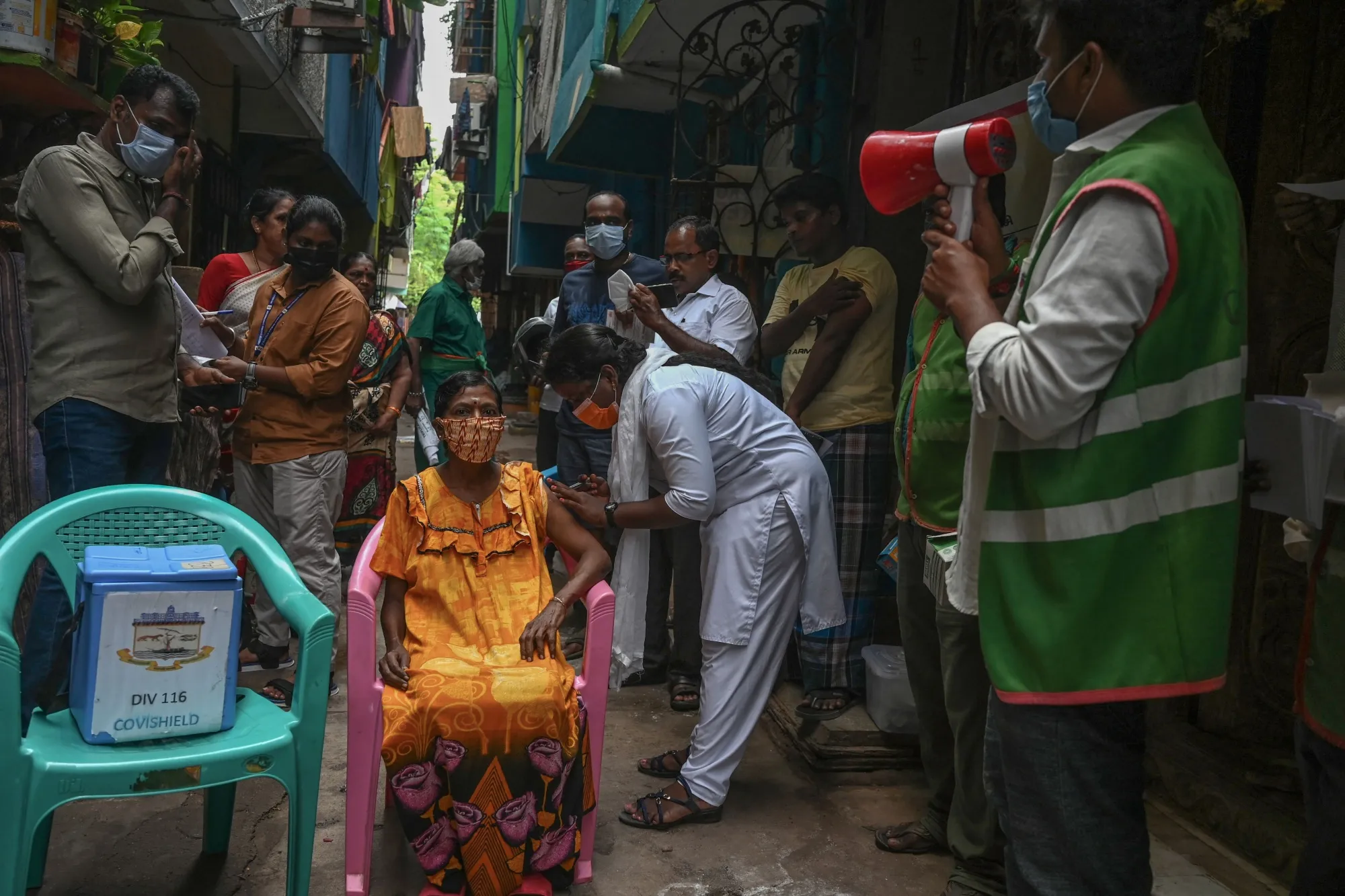 A woman is vaccinated against Covid-19 during a door to door vaccination campaign in Chennai on Oct. 19.