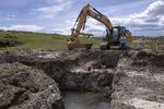 A water treatment operator looks at a construction site near Rawlins, Wyoming, on&nbsp;June 3.