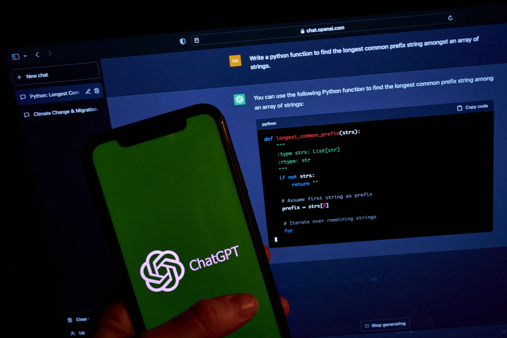 The ChatGPT chat screen on a laptop computer and logo on a smartphone. Goldman Sachs says that broad adoption of artificial intelligence has the potential for major macroeconomic effects.