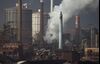 Emissions rise from chimneys at the Nippon Steel & Sumitomo Metal Corp. plant stands in Kashima, Ibaraki, Japan, on Wednesday, April 18, 2018. President Donald Trump and Japanese Prime Minister Shinzo Abe committed Wednesday to intensify bilateral trade talks. Trump is pushing for an agreement that would reduce the U.S. trade deficit with Japan, while Abe is seeking an exemption from the steel and aluminum tariffs that Trump announced last month.