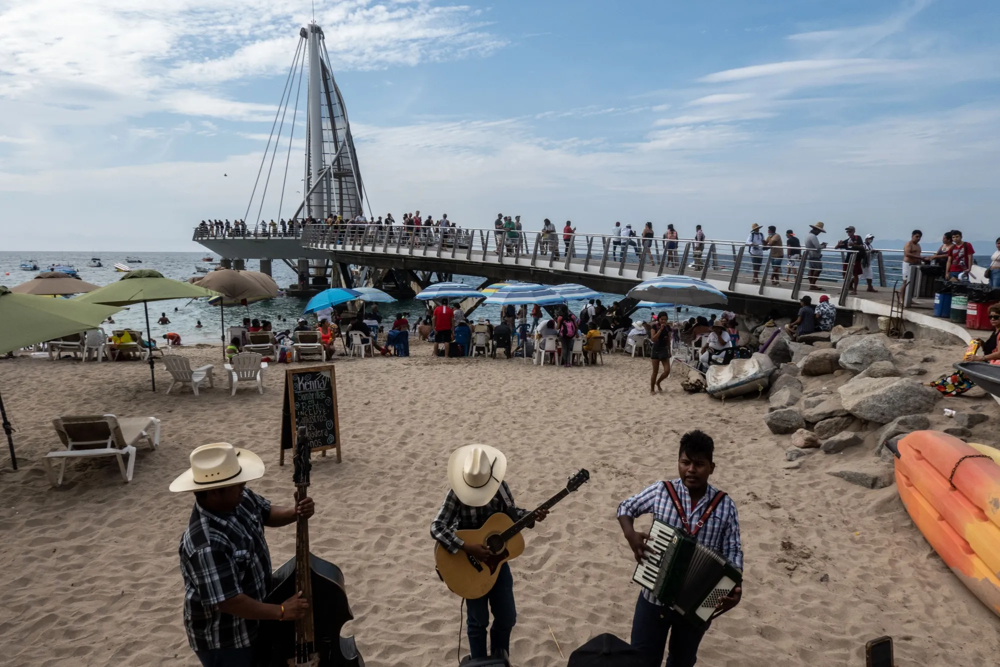 Musicians play near the Los Muertos Beach Pier in Puerto Vallarta, Jalisco state, Mexico.