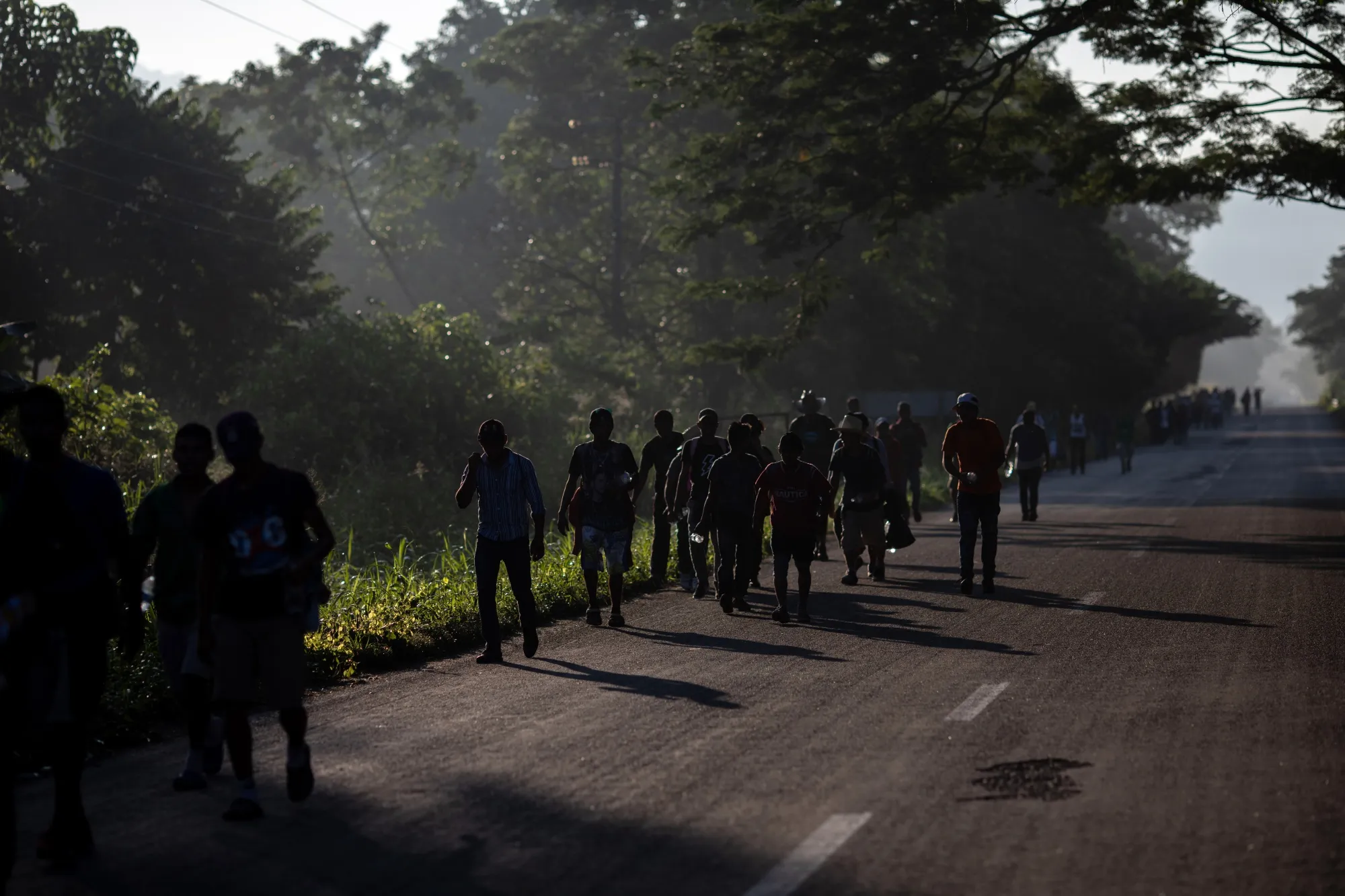 Refugees and asylum seekers walk towards Mapastepec in Escuincla, Chiapas state, Mexico, Oct. 2018.