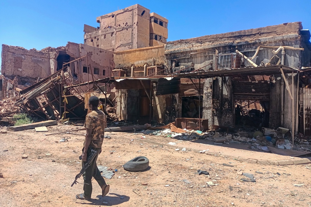 TOPSHOT - A fighter loyal to the army patrols a market area in Khartoum on March 24, 2025. For nearly two years, Sudan has been ravaged by a war between the regular army and the RSF, a conflict that has killed tens of thousands of people, uprooted over 12 million more and created the world's largest hunger and displacement crises. (Photo by AFP) (Photo by -/AFP via Getty Images) Photographer: -/AFP