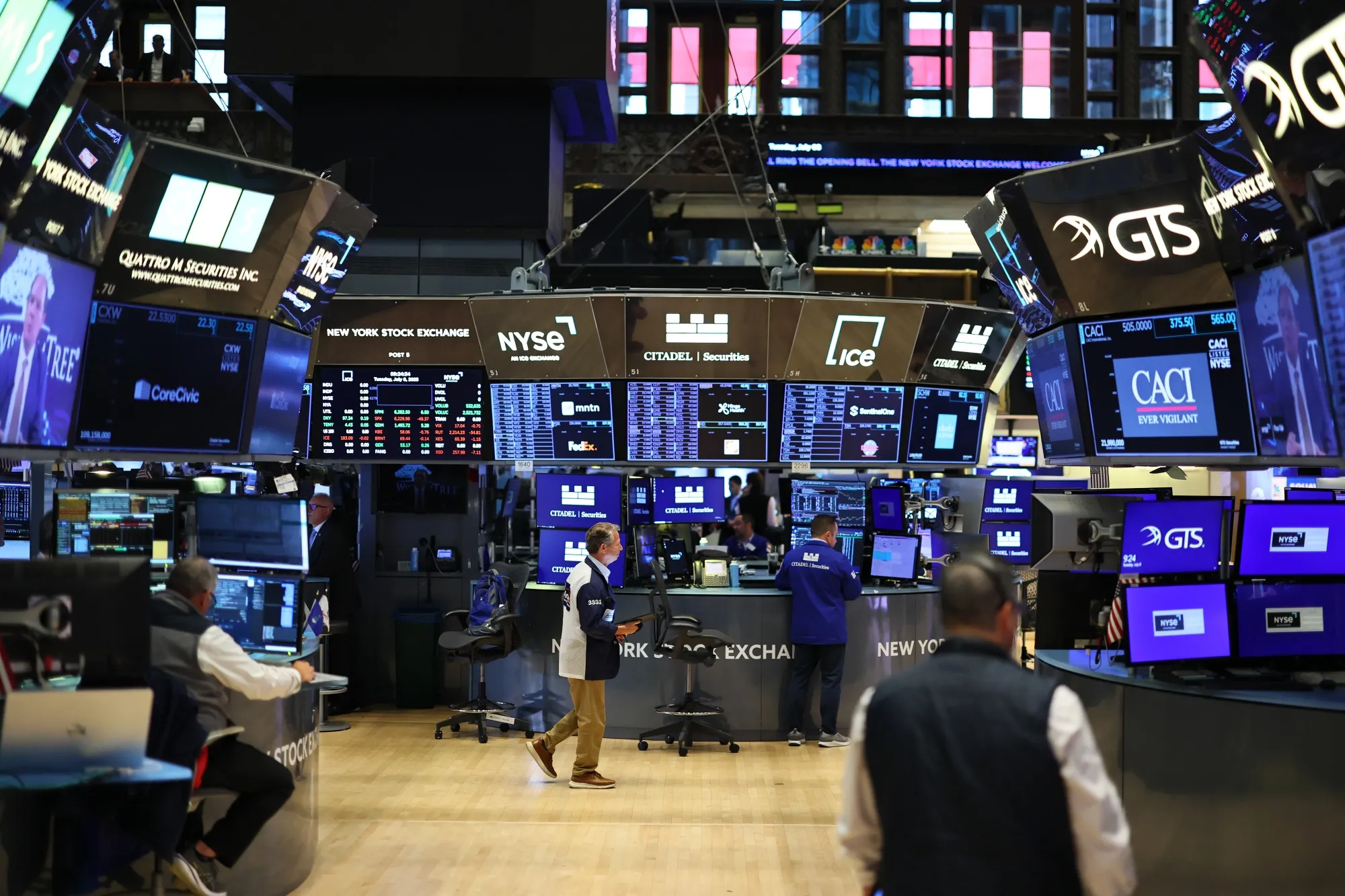 Traders work on the floor of the New York Stock Exchange.