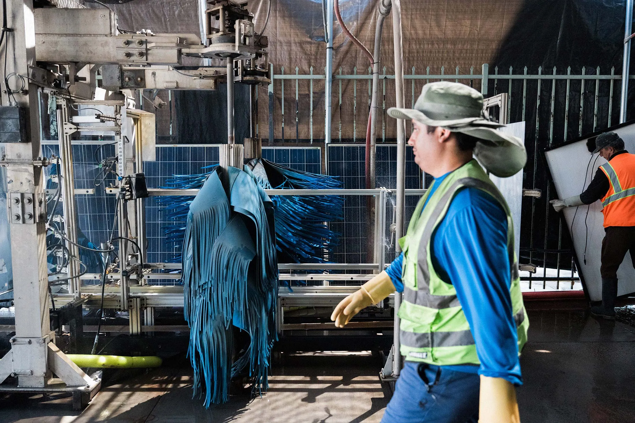 Panels from decommissioned solar projects undergo cleaning at SanTan Solar in Gilbert, Arizona, before being listed for resale.