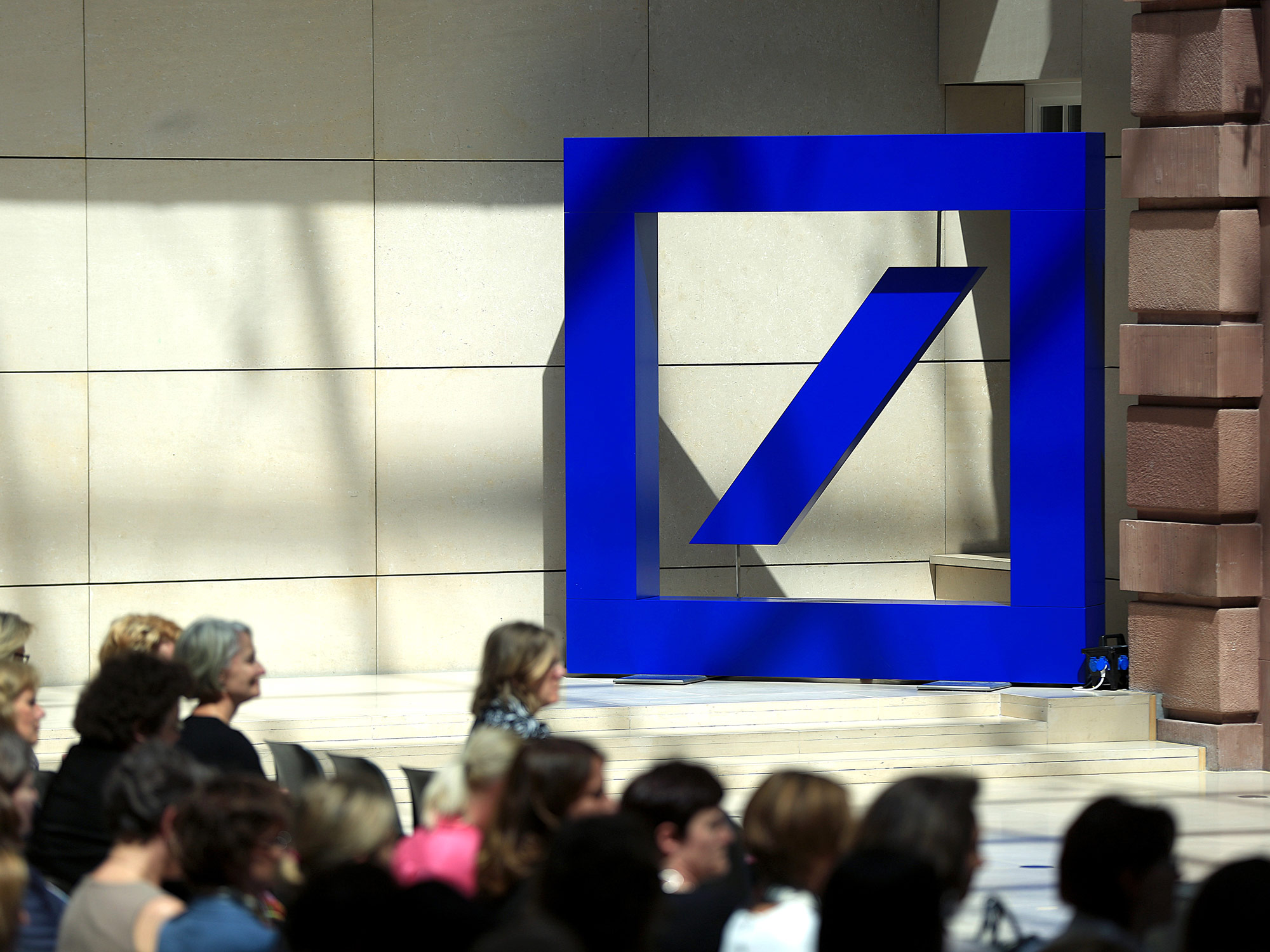 A Deutsche Bank AG logo stands&nbsp;inside the company's offices in Berlin, Germany.