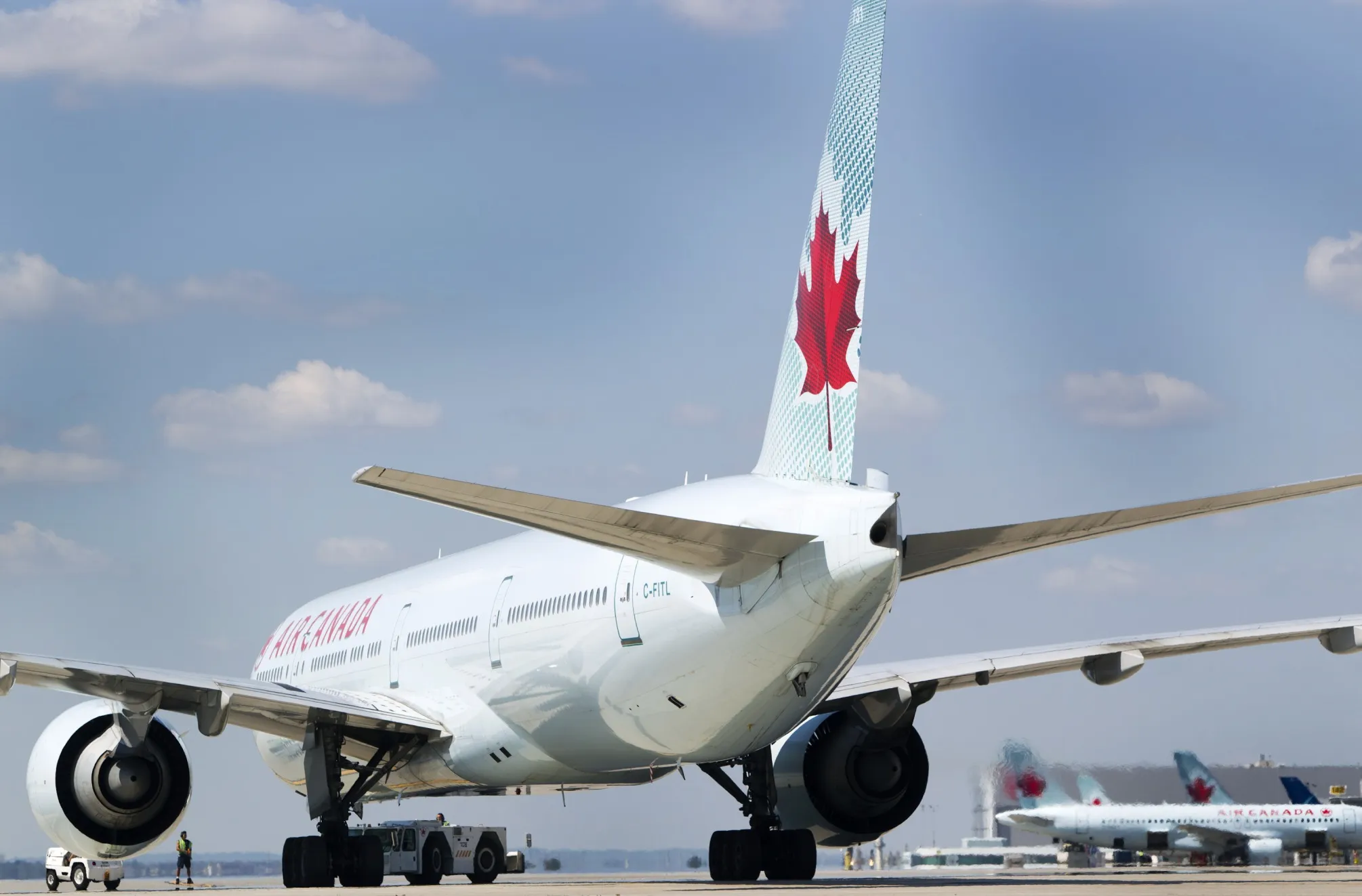 An Air Canada Boeing Co. 777-333/ER plane sits on the tarmac before takeoff at Toronto Pearson International Airport in Toronto, Ontario, Canada.