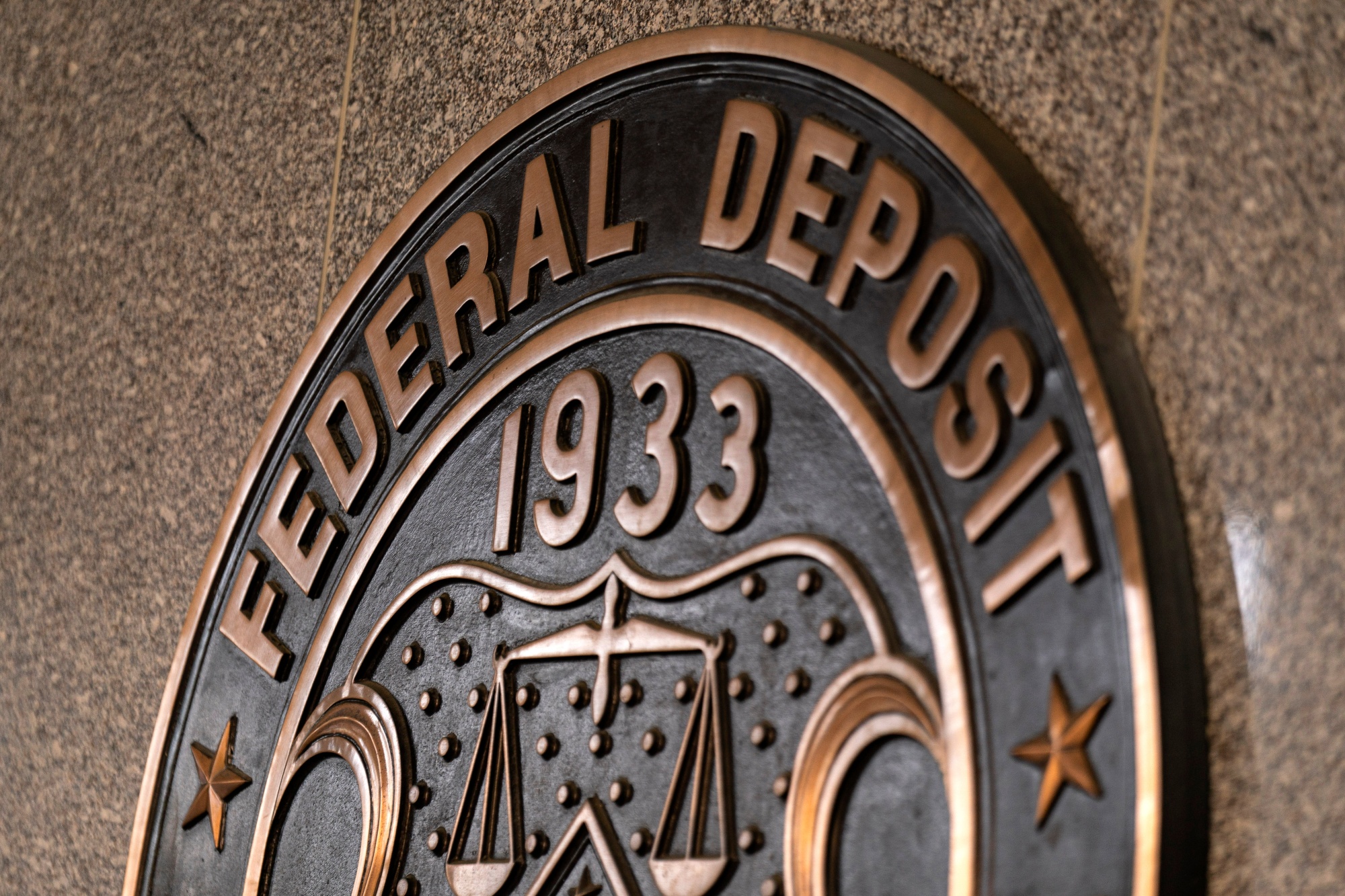 The Federal Deposit Insurance Corp. (FDIC) headquarters in Washington, DC, US, on Monday, May 20, 2024. Earlier this month, the Federal Deposit Insurance Corp., the Office of the Comptroller of the Currency, and the Federal Housing Finance Agency announced that they had taken an initial step toward imposing the long-delayed Dodd-Frank Act rule, which would force banks to claw back some pay from executives taking on too much risk. Photographer: Al Drago/Bloomberg