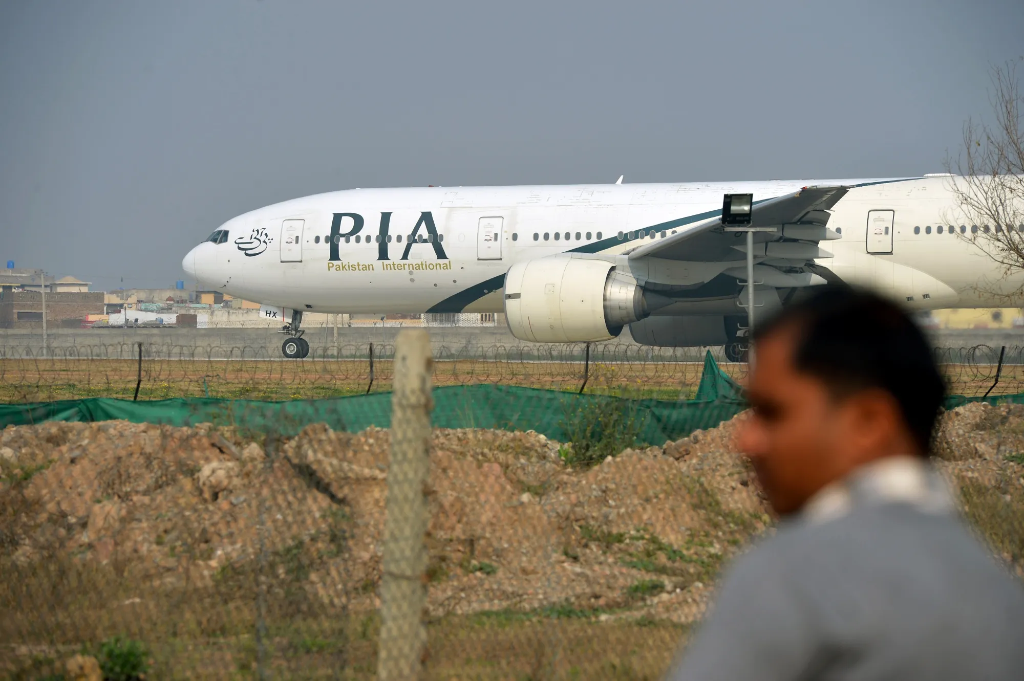 A Pakistan International Airline plane taxis on the runway in Islamabad.