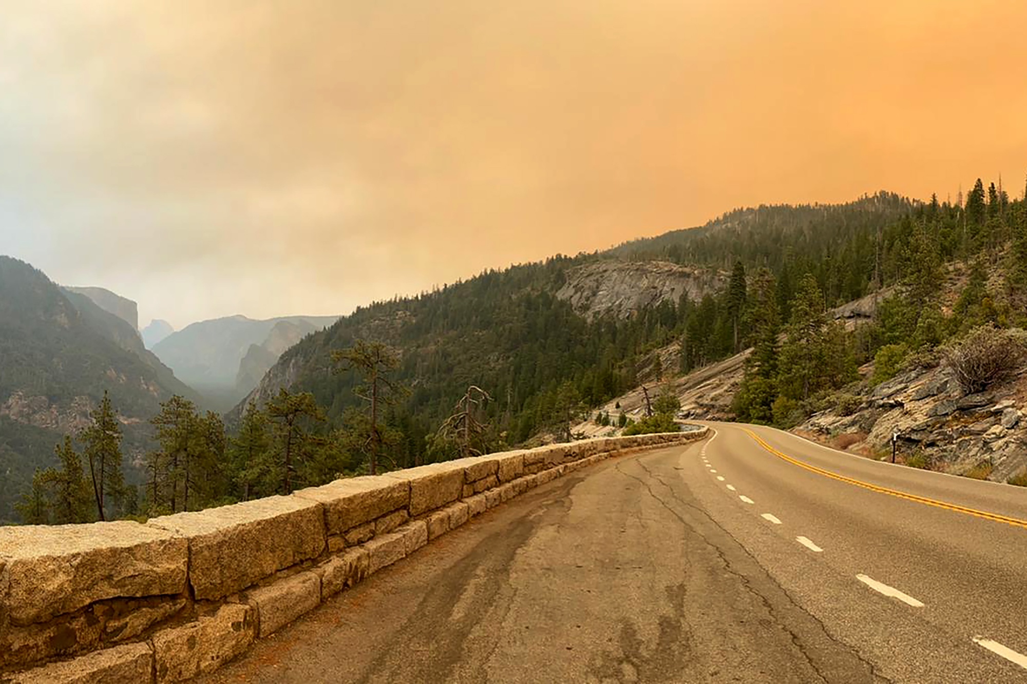 Smoke from the Creek Fire settles over a road in Yosemite National Park, California, U.S., on Saturday, Sept. 5, 2020.