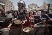 Palestinians struggle with hunger in Gaza wait for food