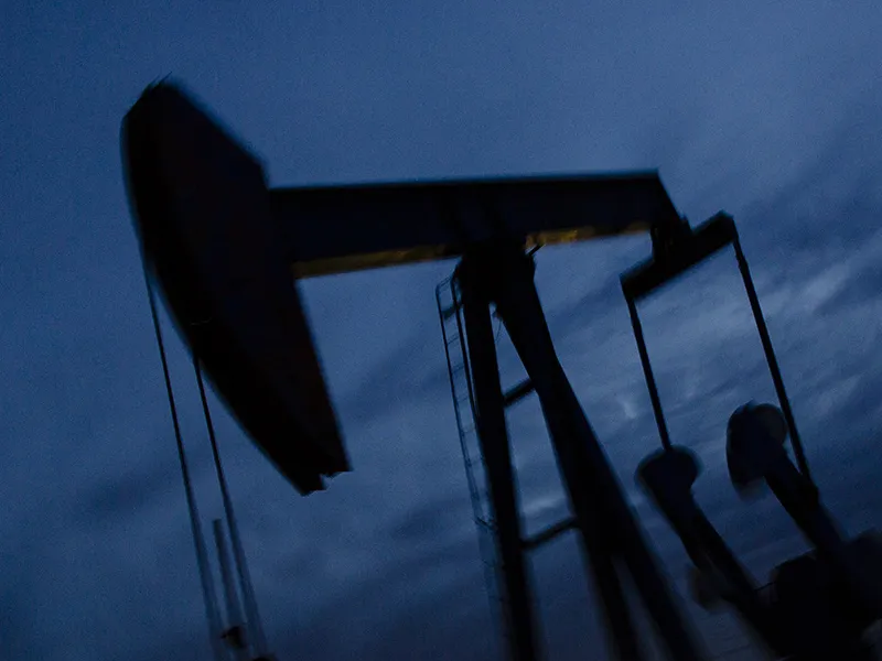 A pump jack stands at dusk in the Permian Basin area in Texas, U.S.