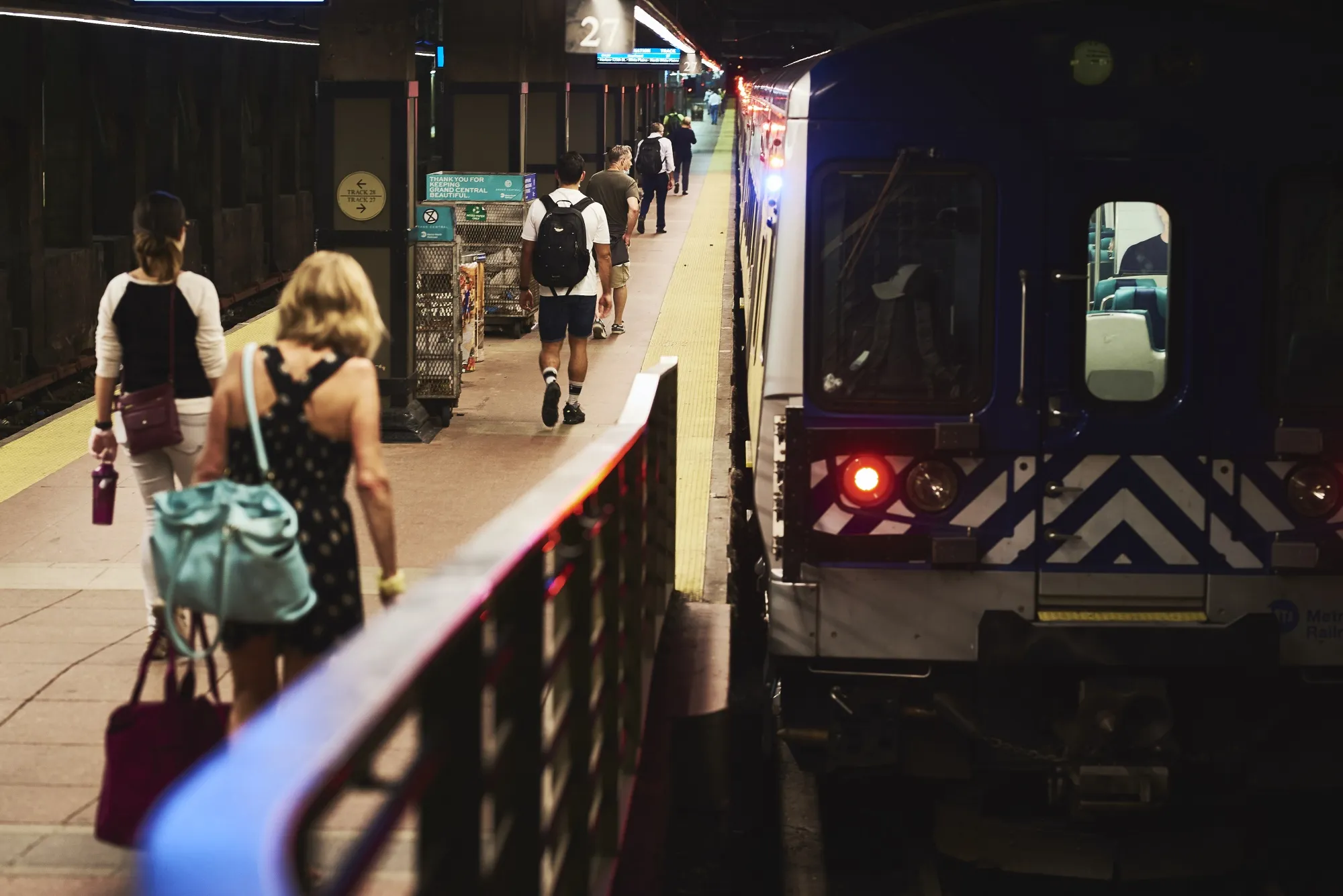 Commuters enter a Metro-North Railroad train at Grand Central Terminal in New York.