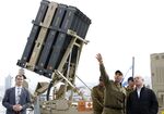 Netanyahu stands near a naval Iron Dome defence system on Feb. 12.