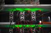 Lights illuminate as application-specific integrated circuit (ASIC) devices and power units operate inside a rack at the BitRiver Rus LLC cryptocurrency mining farm in Bratsk, Russia, on Friday, Nov. 8, 2019. Bitriver, the largest data center in the former Soviet Union, was opened just a year ago, but has already won clients from all over the world, including the U.S., Japan and China. Most of them mine bitcoins.