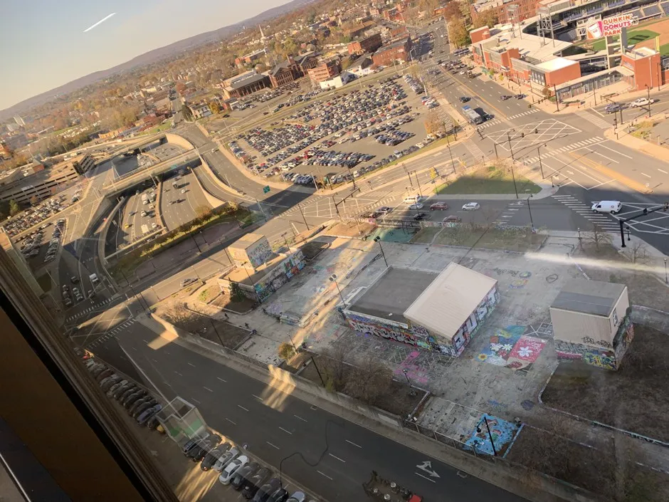 The shadow of downtown towers looms over I-84, the highway that cuts Hartford in two. It's overdue for replacement, but with what?