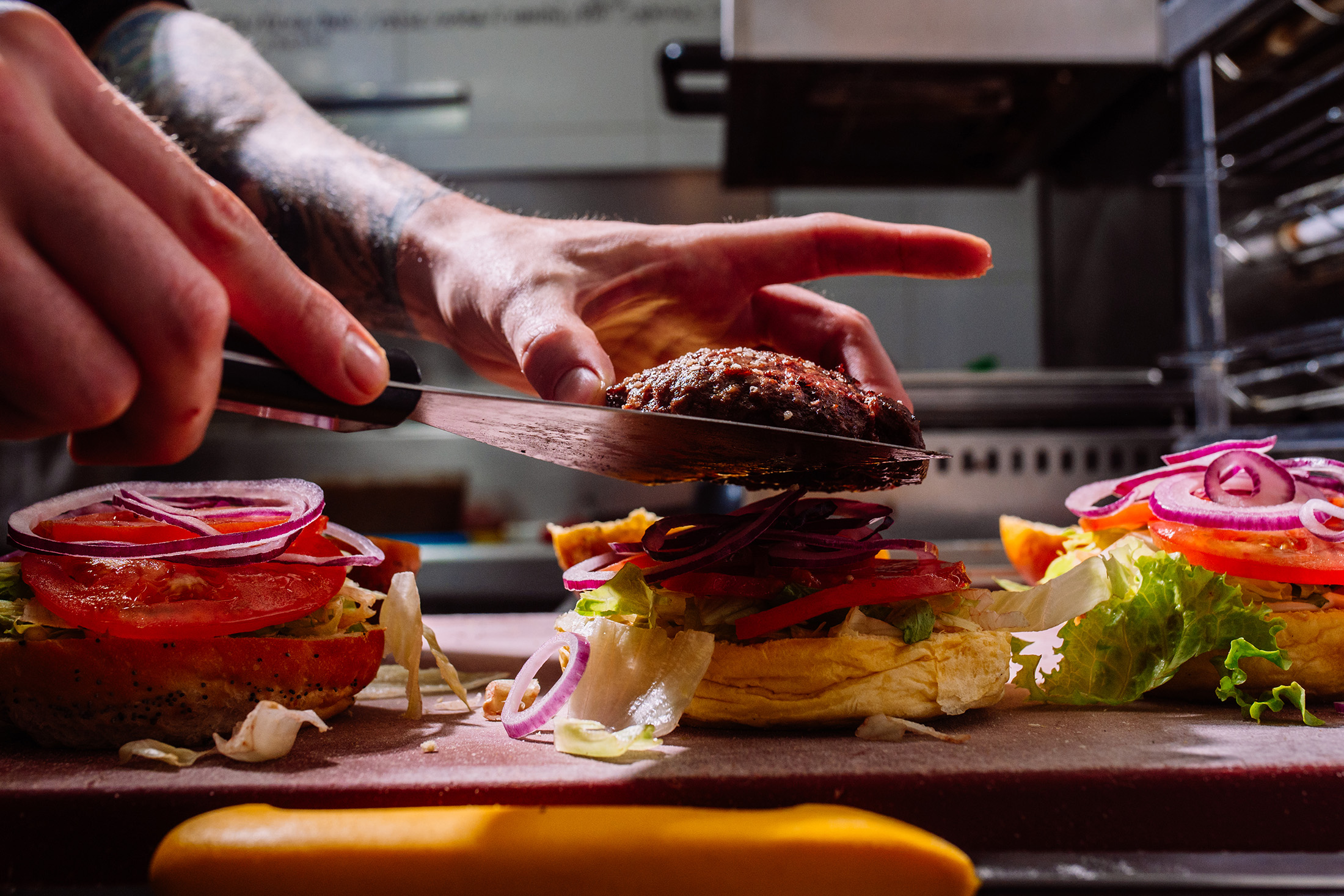 Assembling a burger.