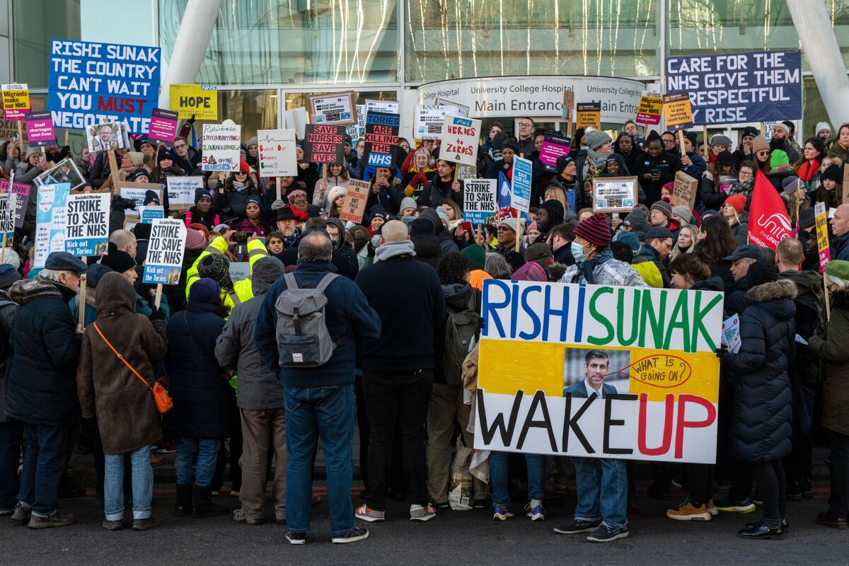 A protester holds up a Royal College Of Nursing placard as Alex News  Photo - Getty Images