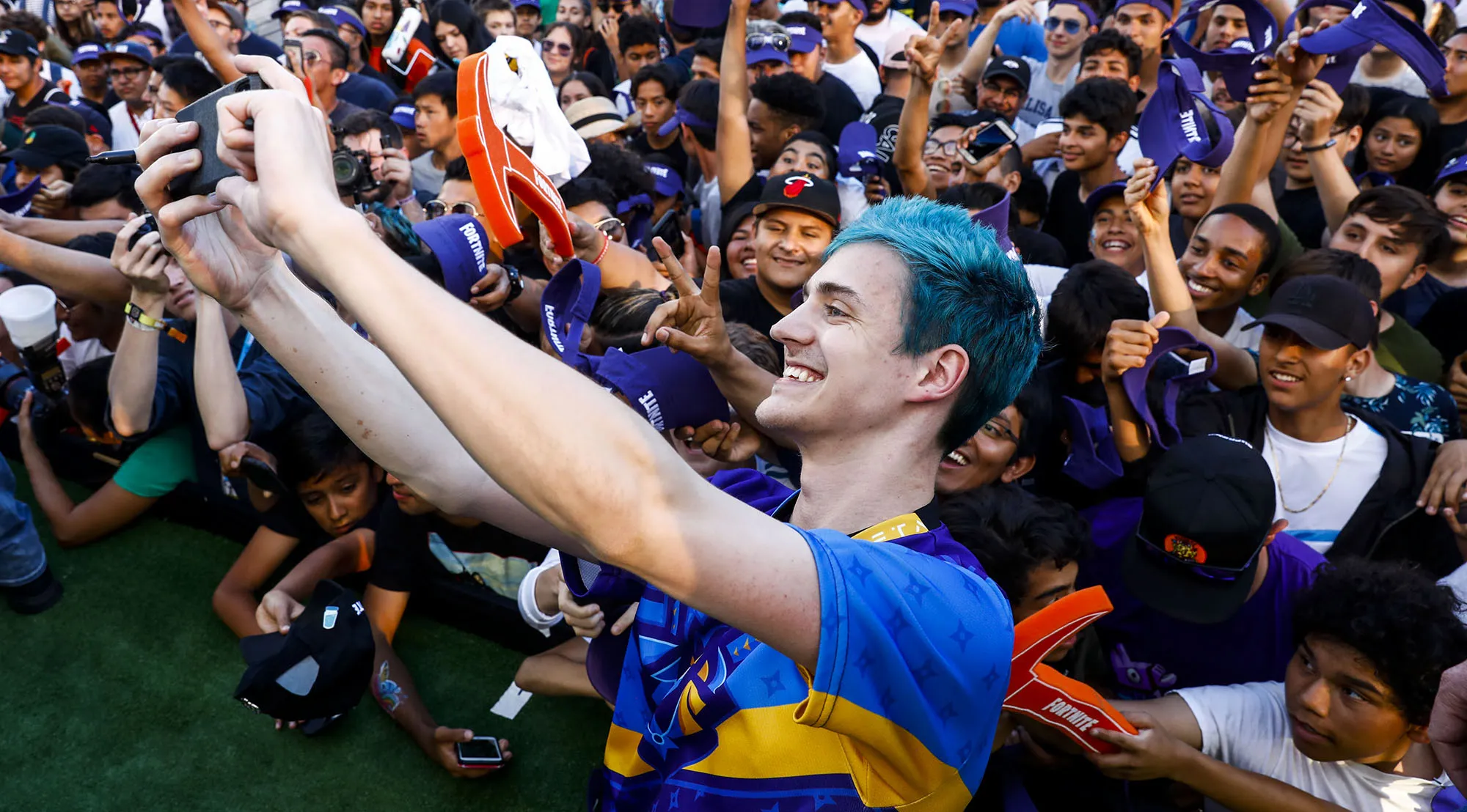 Ninja takes a selfie with attendees at an event in Los Angeles.