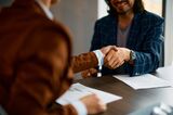 Close up of business colleagues handshaking on a meeting in the office.