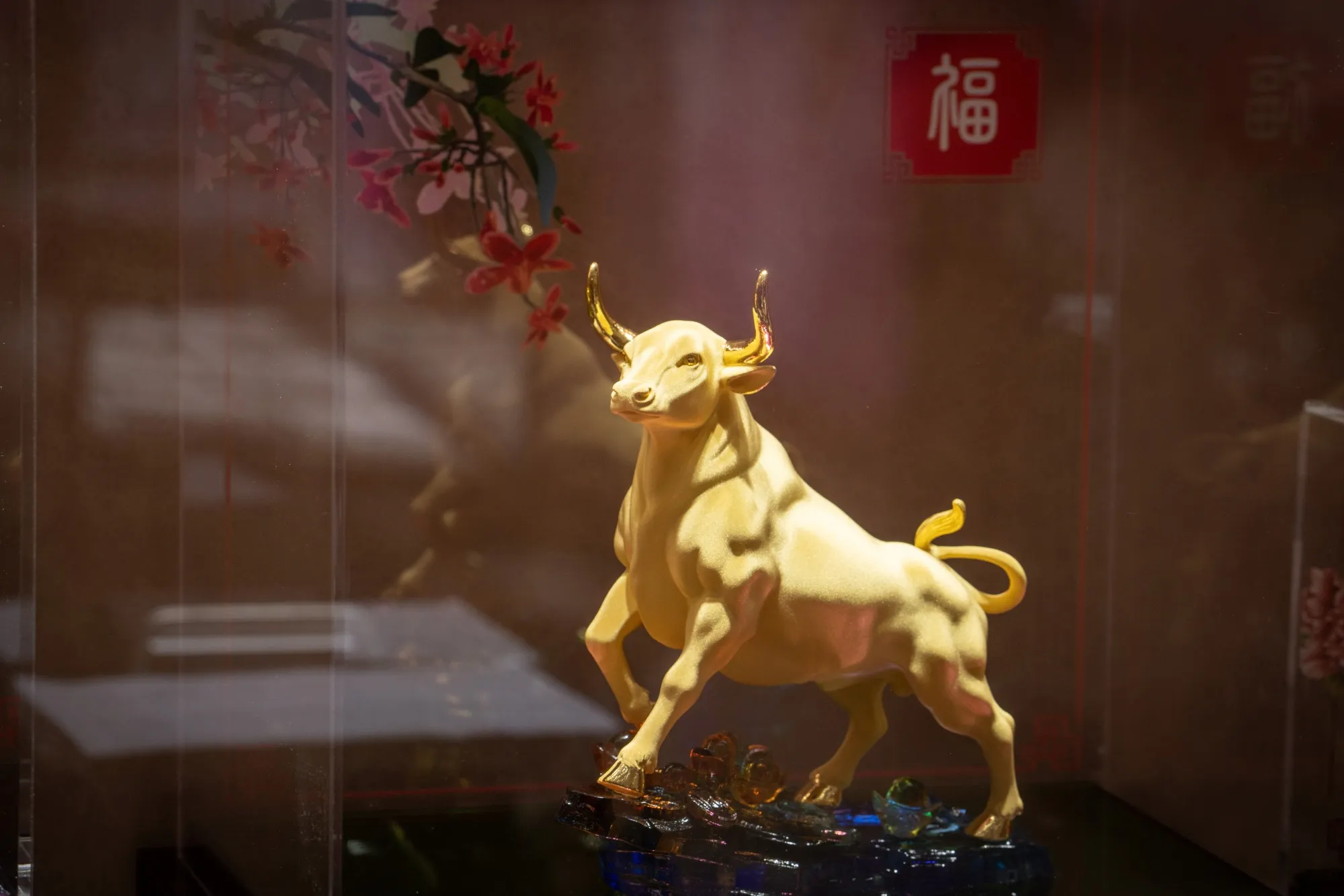 A gold ox figurine on display at a Luk Fook Holdings jewelry store in Beijing, on Feb. 8.