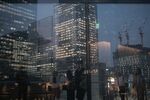 Buildings reflected in windows in Tokyo. Photographer: Soichiro Koriyama/Bloomberg