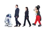 From left, R2-D2, Disney Chairman and CEO Robert Iger, Lucasfilm President Kathleen Kennedy, and Mickey Mouse
