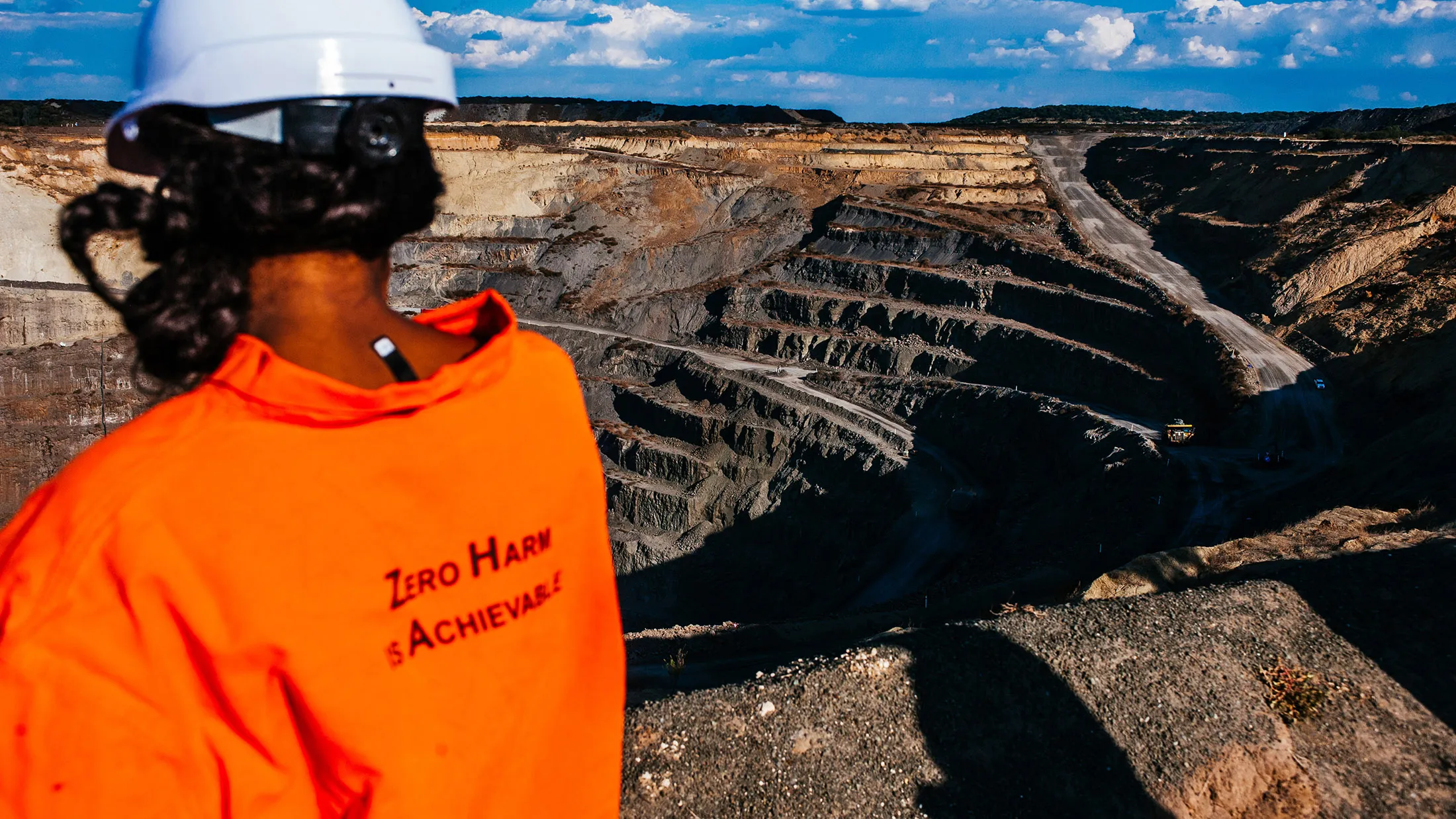 An employee looks across the open pit of the Voorspoed diamond mine, operated by De Beers SA, in Kroonstad, South Africa, on Tuesday, May 3, 2017. The Anglo American Plc unit plans to store carbon-dioxide in kimberlite -- a type of ore best known for containing diamonds, but which also naturally reacts with carbon to remove it from the atmosphere.
