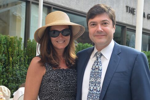 Eva Dillon, in an Eric Javits sun hat, and Brendan Dillon of UBS. Photographer: Amanda Gordon/Bloomberg