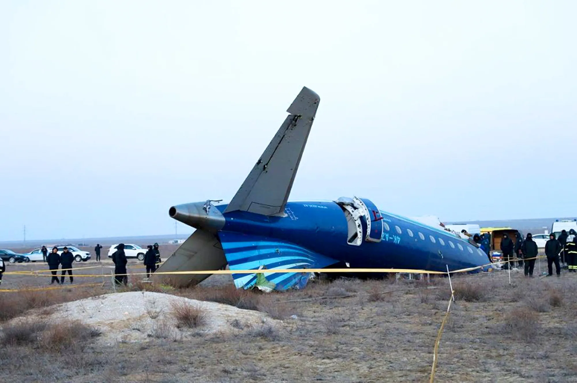 In this photo taken from a video released by the administration of Mangystau region, a part of Azerbaijan Airlines' Embraer 190 lies on the ground near the airport of Aktau, Kazakhstan, on&nbsp;Dec. 26.