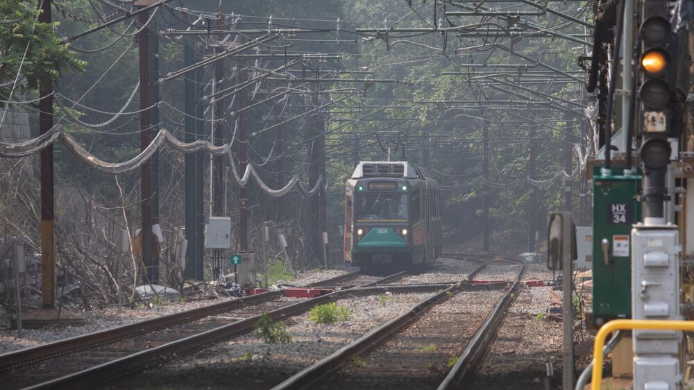 A Massachusetts Bay Transportation Authority Green Line train in Newton drifts through the smoke from western wildfires that blanketed Boston and its suburbs Monday and set off air quality alerts from Connecticut to Maine.