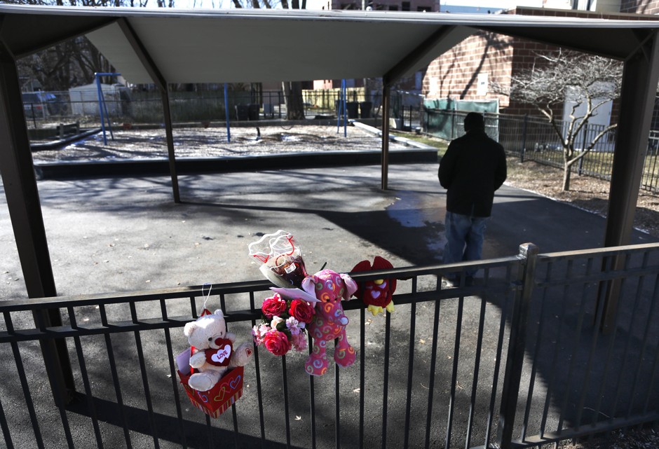 A man stands motionless where Hadiya Pendleton, a 15-year-old girl from Chicago, was shot and killed on January 29, 2013.