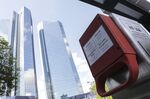 An emergency stop handle in front of the Deutsche Bank headquarters in Frankfurt on July 7.