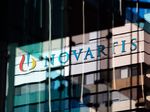 A logo sits on display on a building at the Novartis AG campus.
