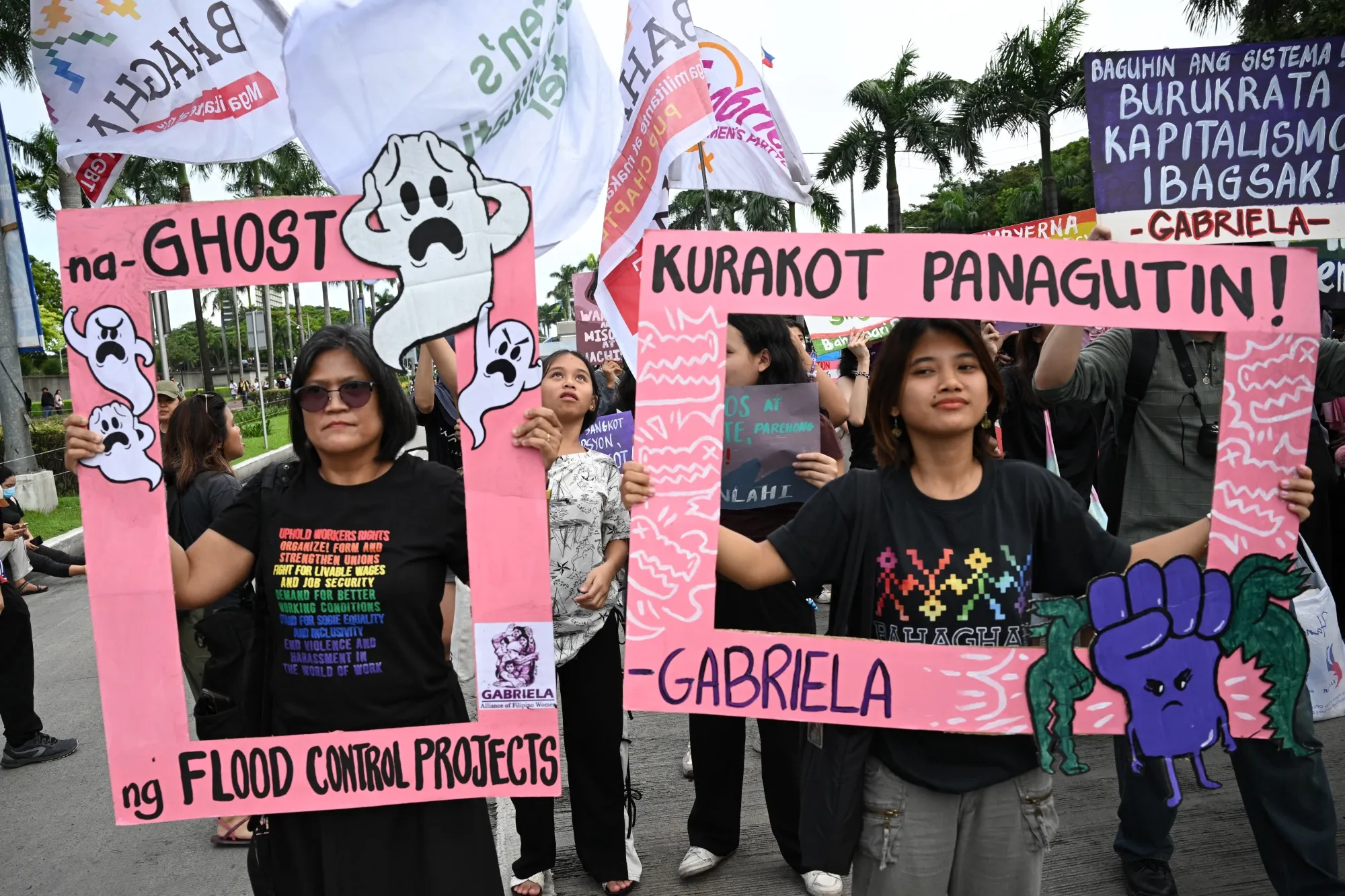 Protesters hold placards during a rally following&nbsp;scandals in the government’s flood-control projects, in Manila on Sept. 21.&nbsp;