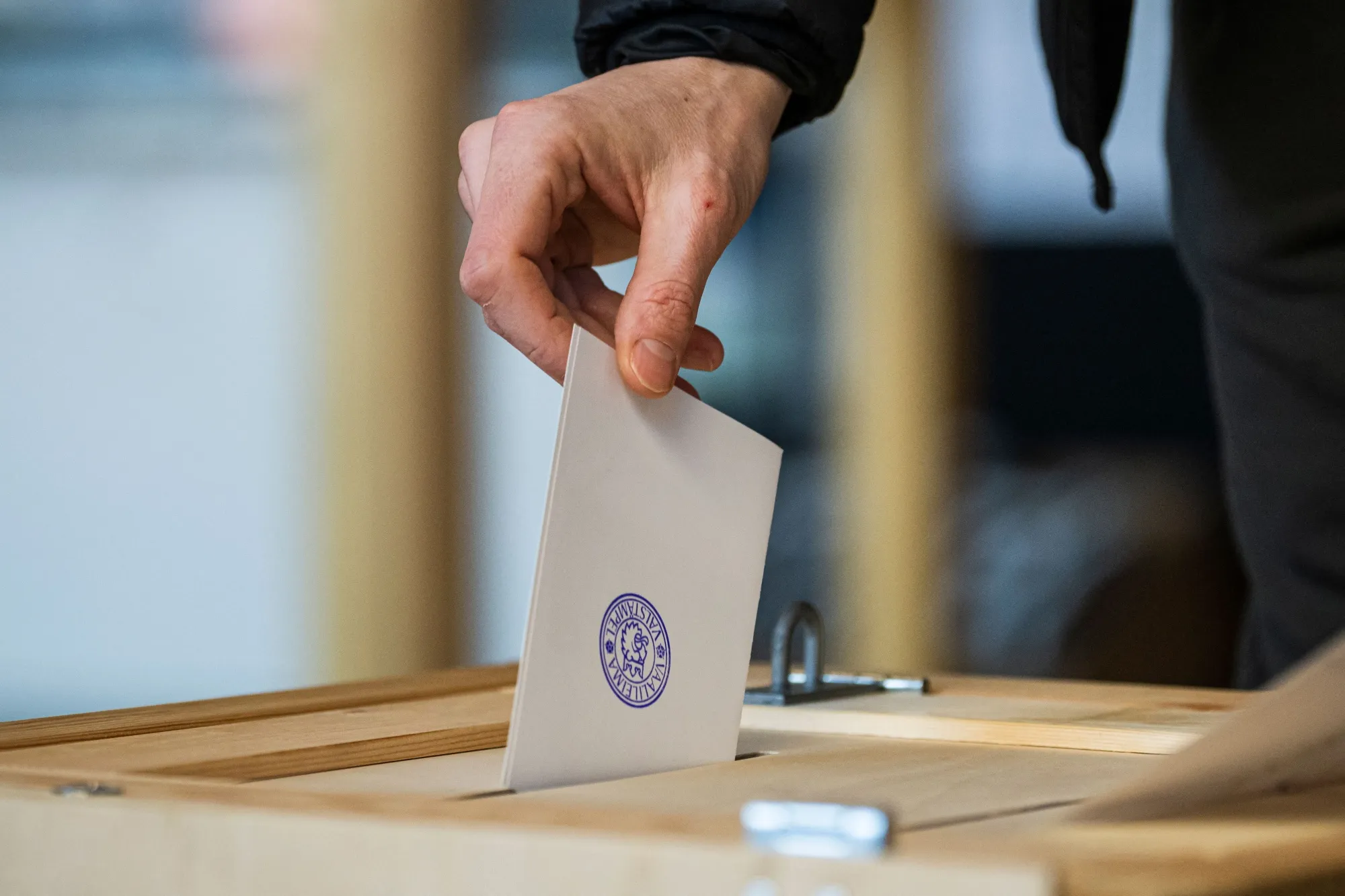 A voter casts his ballot at a polling station in Helsinki, in 2023.