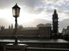 Pedestrians step through puddles of rainwater as they walk along the South Bank of the River Thames, opposite the Houses of Parliament in central London on September 24, 2019 after the judgement of the Supreme Court on the legality of Boris Johnson's advice to the Queen to suspend parliament for more than a month, as the clock ticks down to Britain's October 31 EU exit date. - British Prime Minister Boris Johnson on Tuesday said he disagreed with but would respect the Supreme Court ruling which found his decision to suspend parliament unlawful. "I have to say that I strongly disagree with what the justices have found. I don't think that it's right but we will go ahead and of course parliament will come back," he told British broadcasters during a visit to New York. (Photo by Tolga AKMEN / AFP) (Photo credit should read TOLGA AKMEN/AFP/Getty Images)