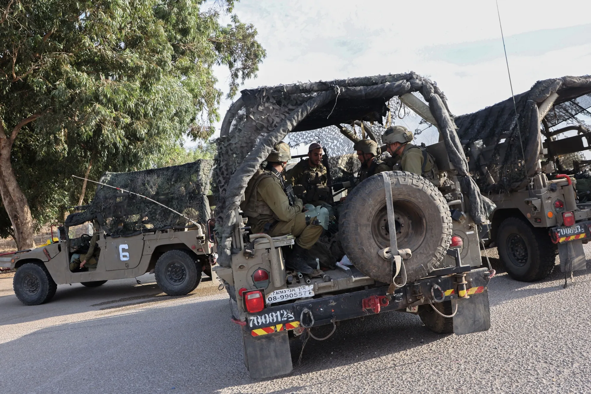 Israeli soldiers take position following attacks in Be'er Sheva, Israel, on Oct. 7.